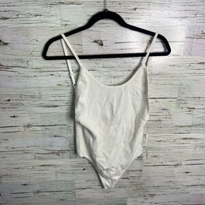 White by the way. Revolve bodysuit size small
